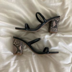 Black a new day heels with snake print heel detail